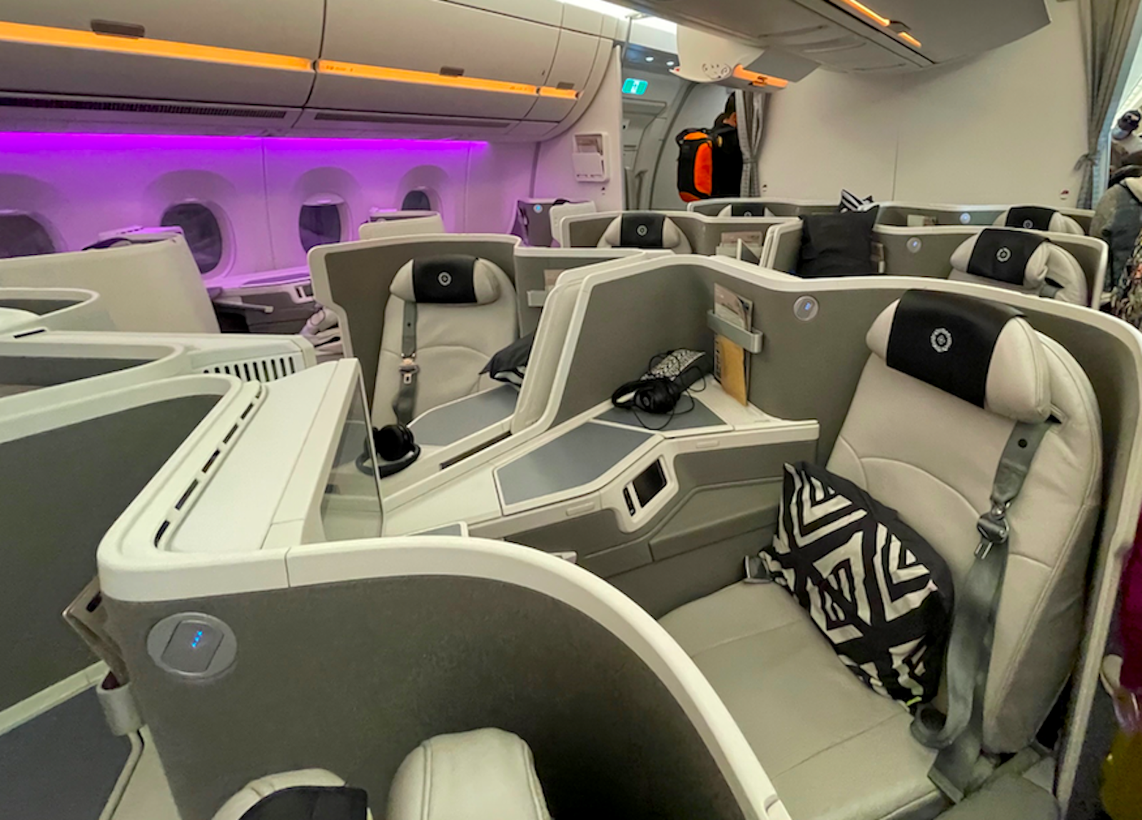 vacation in fiji airlines seat with purple lights